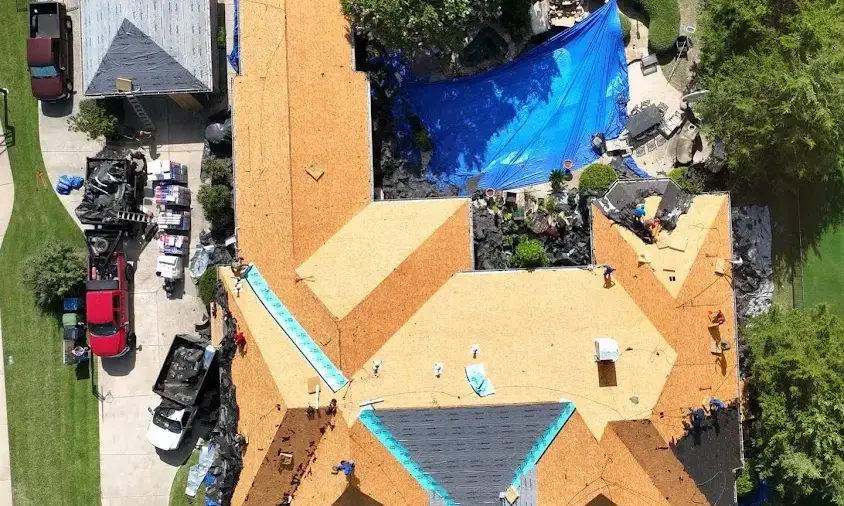 Professional Storm Damage Roof Repair being performed in Summit